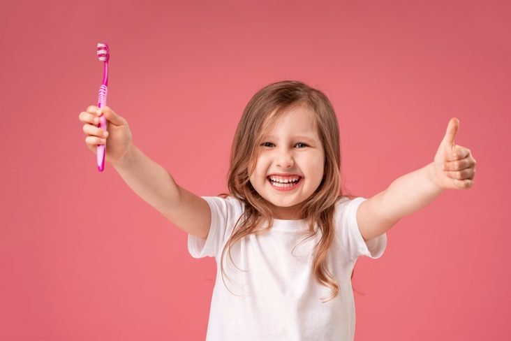 little girl with brush