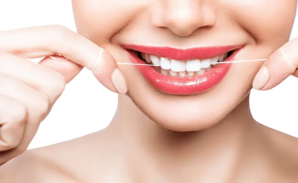 Lady Flossing Teeth