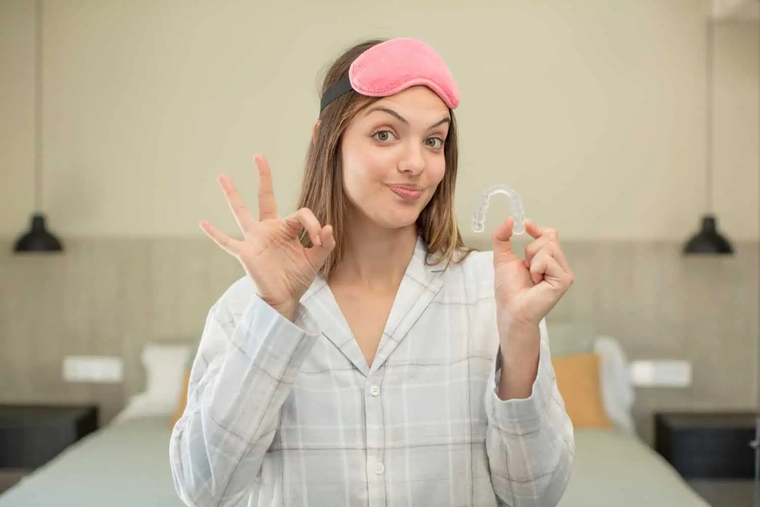 A woman using dental night guard 