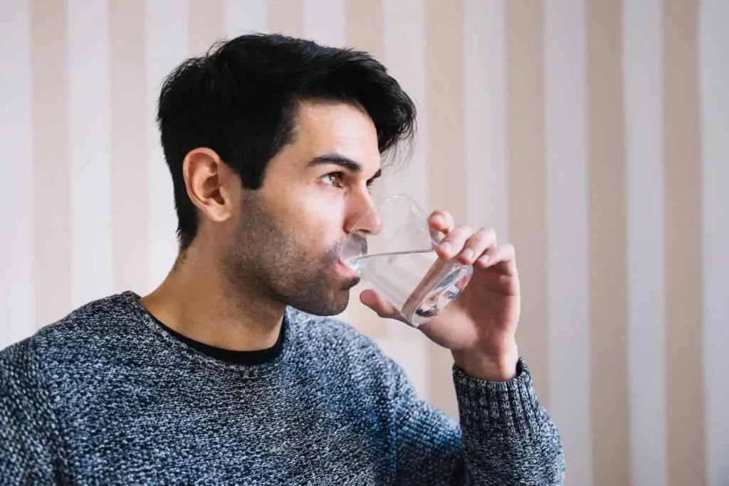 A man drinking water